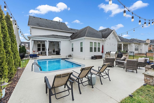 view of pool featuring outdoor lounge area, a patio, and ceiling fan