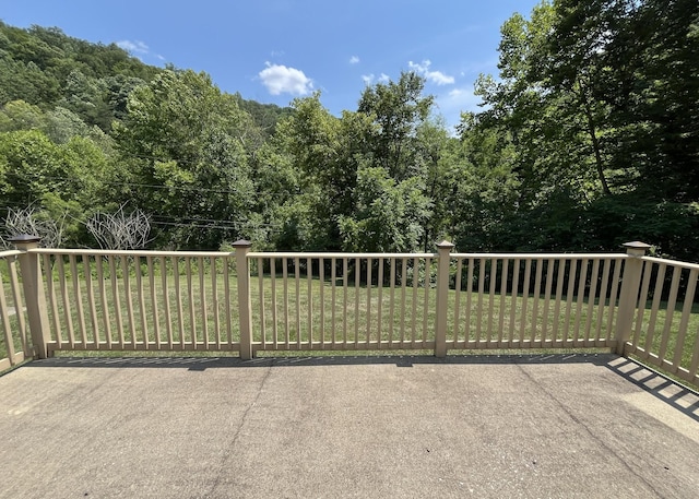 view of gate featuring a yard