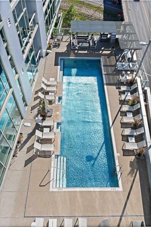 view of pool featuring a patio area