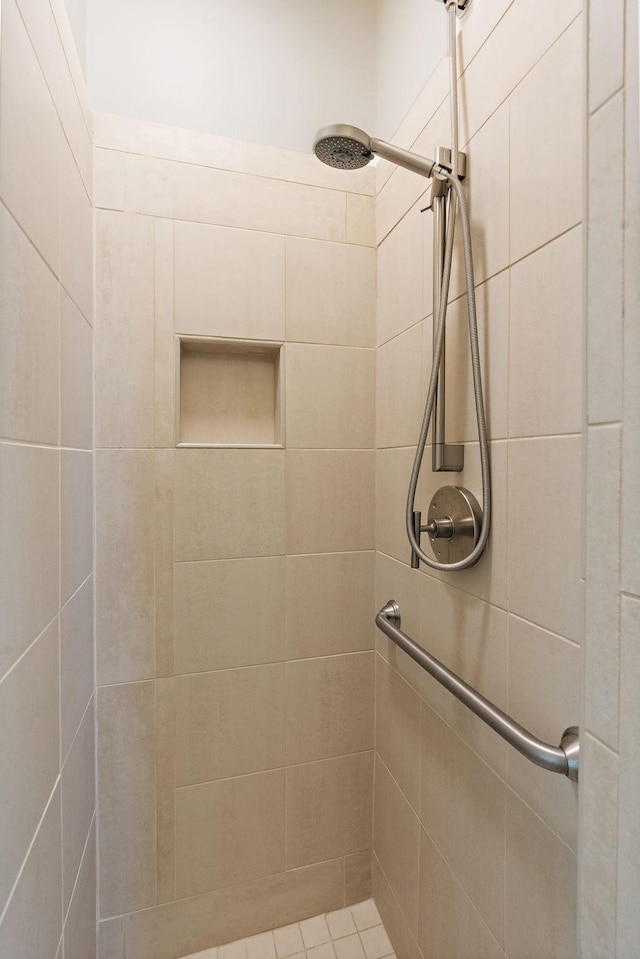 bathroom with a tile shower