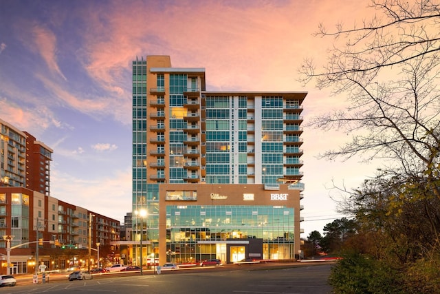 view of outdoor building at dusk