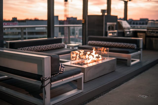 exterior space featuring an outdoor living space with a fire pit