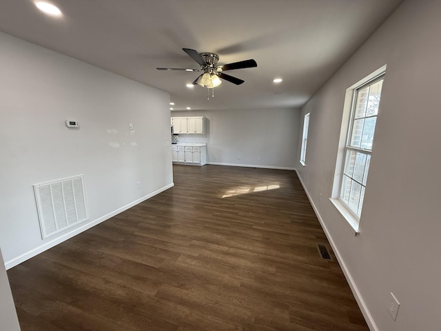 unfurnished room featuring ceiling fan and dark hardwood / wood-style floors