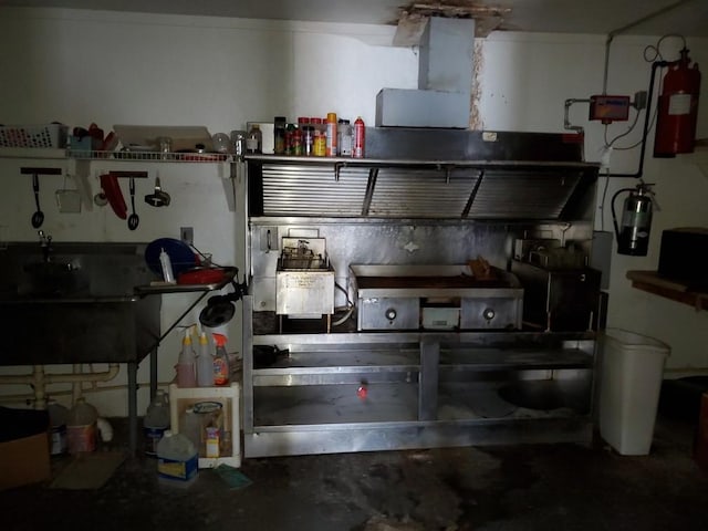 kitchen with concrete flooring and sink