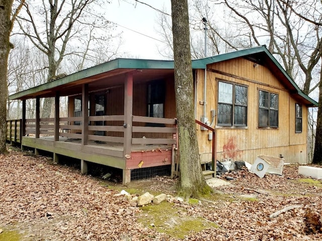 view of property exterior with a deck