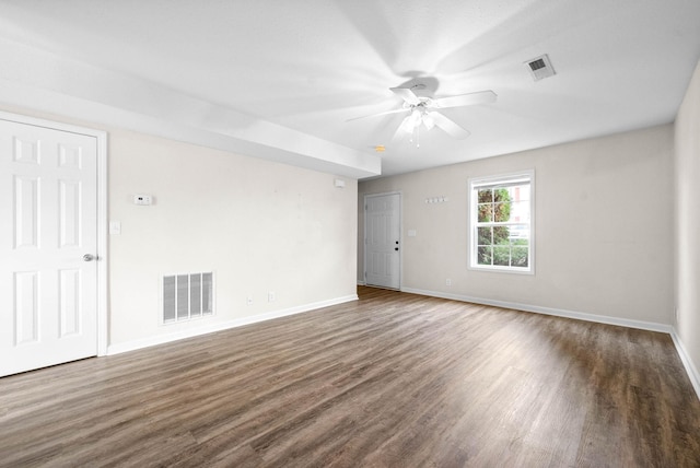 unfurnished room with ceiling fan and dark hardwood / wood-style floors