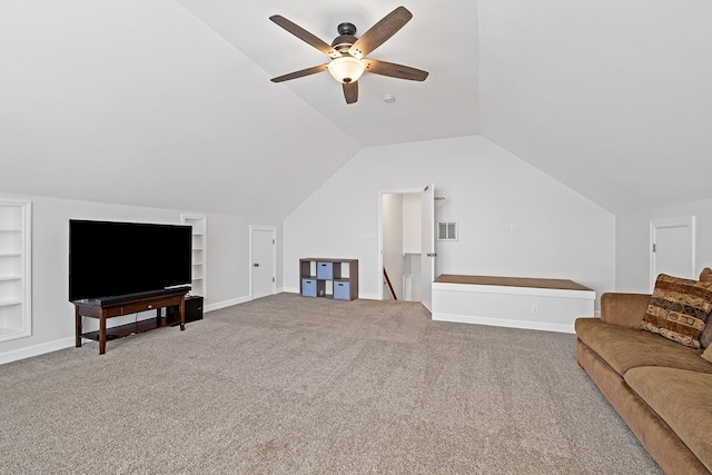 carpeted living room with ceiling fan, lofted ceiling, and built in features