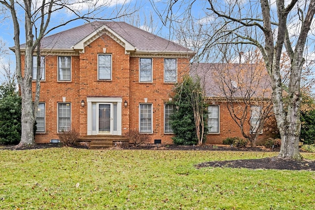 colonial home with a front yard