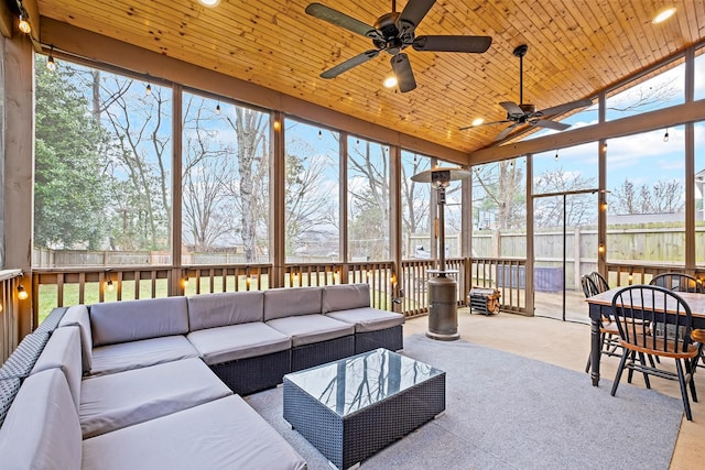 sunroom with lofted ceiling and wooden ceiling