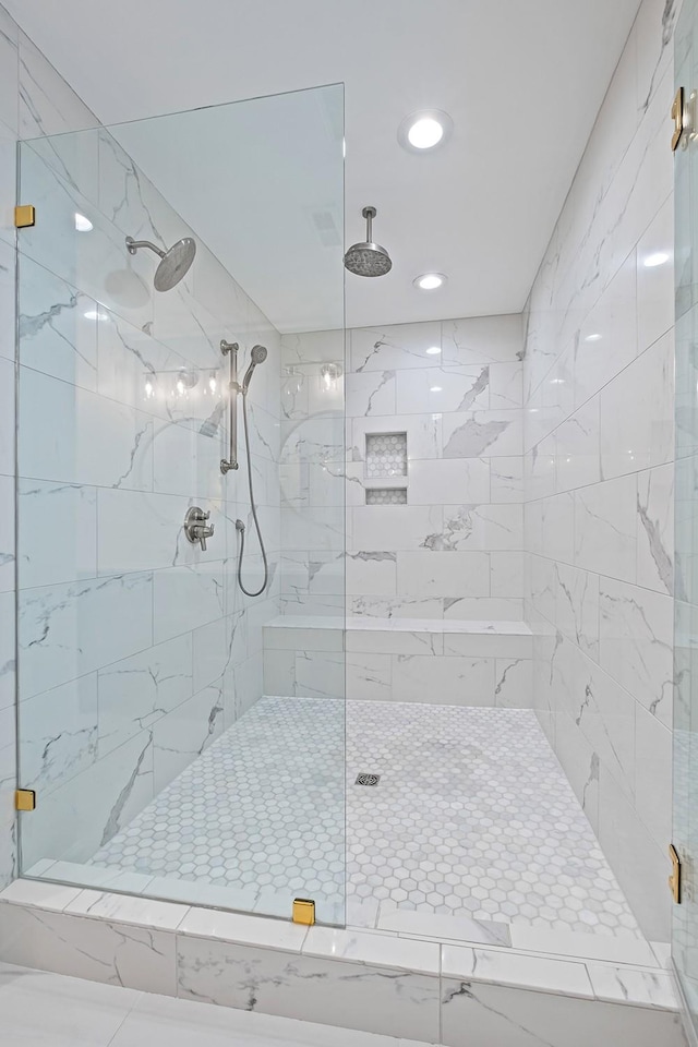 bathroom with a shower with shower door