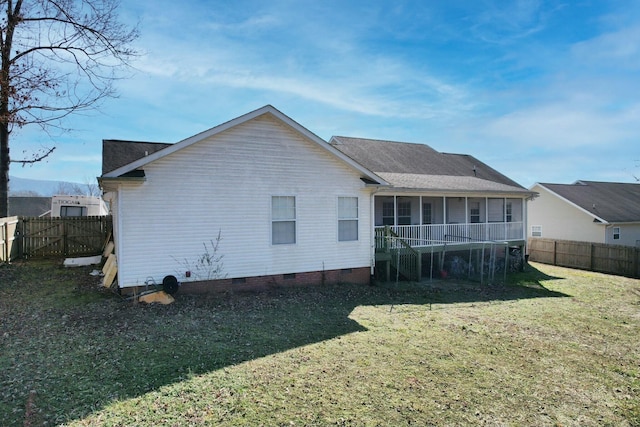 back of house with a yard