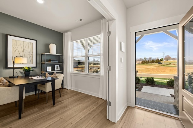 doorway with light hardwood / wood-style floors