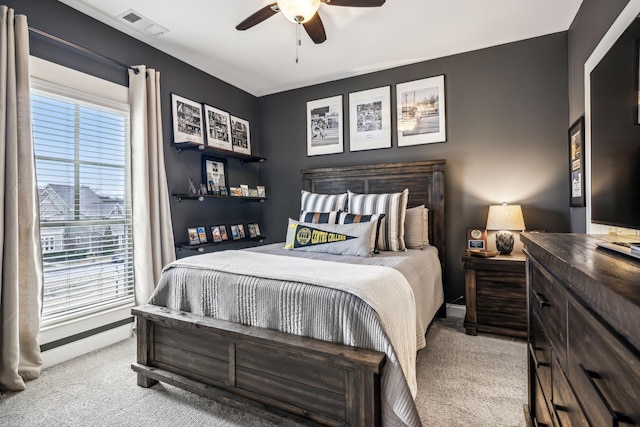 carpeted bedroom with ceiling fan