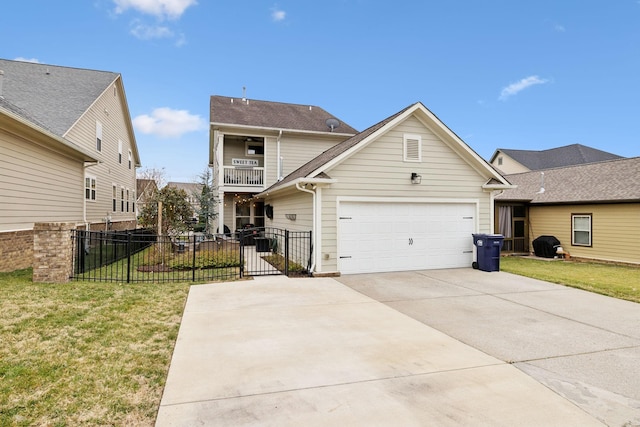 view of property with a balcony and a front yard