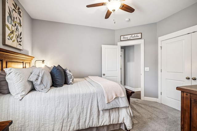 carpeted bedroom featuring ceiling fan