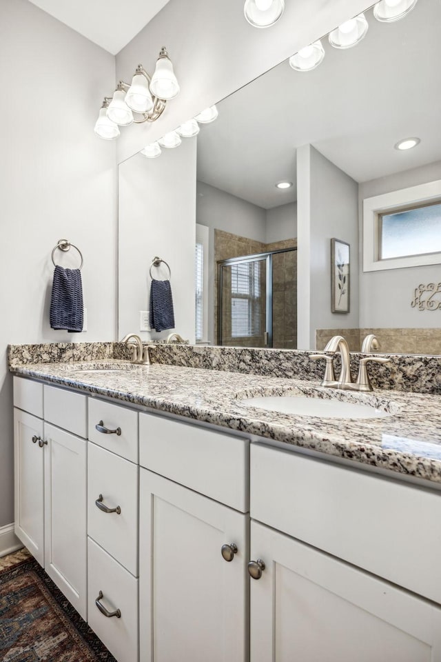 bathroom featuring vanity and walk in shower