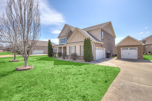 craftsman house with a front lawn, a garage, brick siding, and board and batten siding