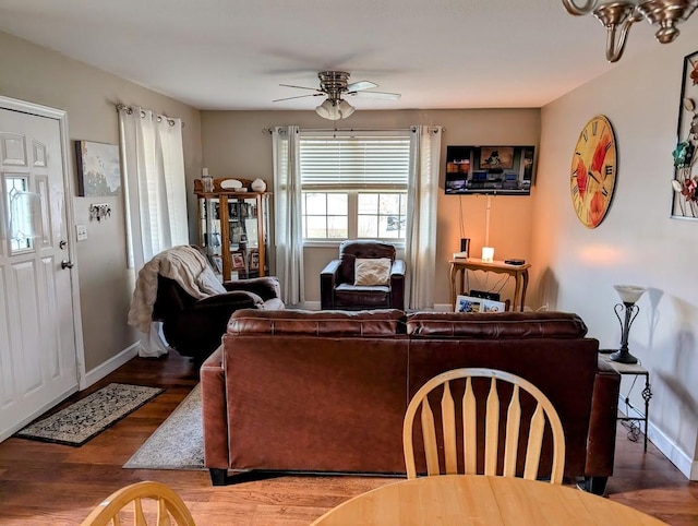 living room featuring hardwood / wood-style flooring and ceiling fan