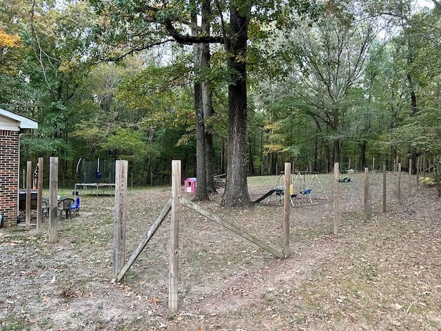 view of yard featuring a trampoline