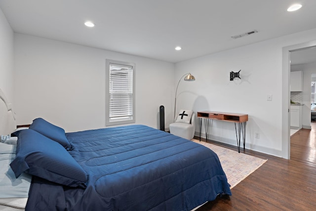 bedroom featuring dark hardwood / wood-style flooring