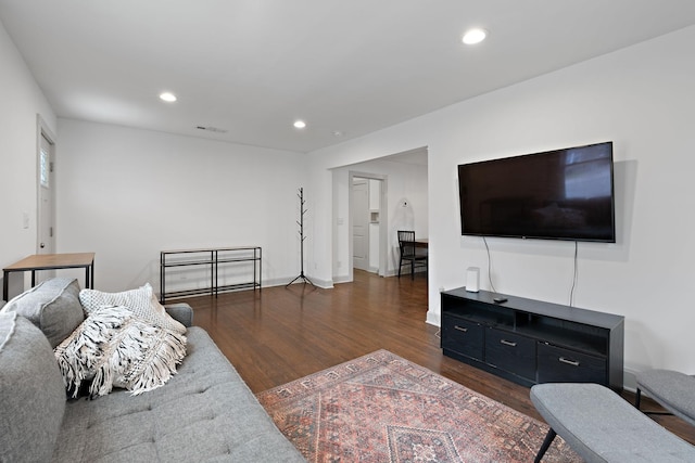 living room featuring dark wood-type flooring