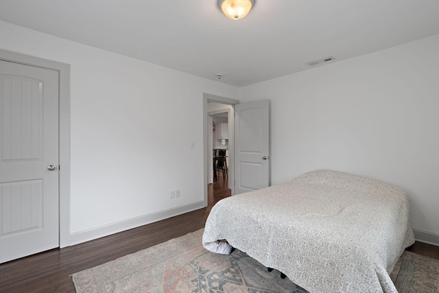 bedroom featuring dark hardwood / wood-style floors