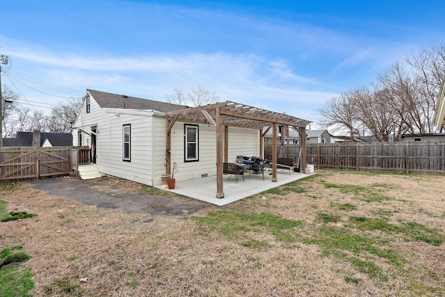 rear view of property with a patio, a lawn, and a pergola