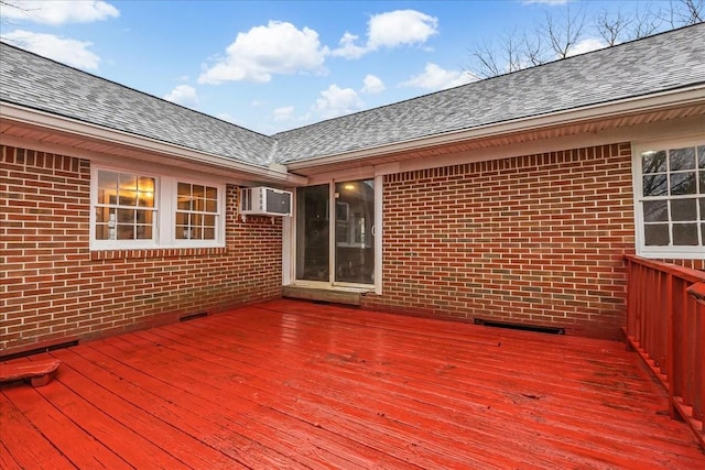 wooden deck with a wall mounted AC