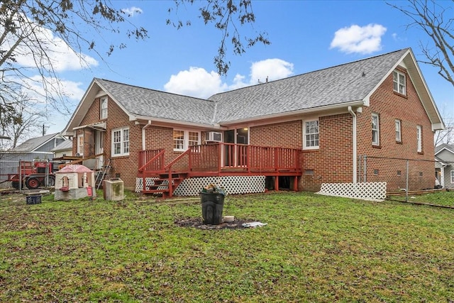 back of property with a wooden deck, a yard, and central air condition unit