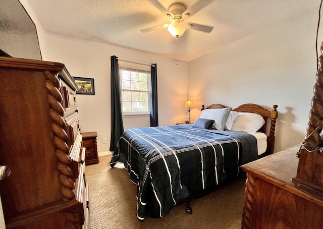 carpeted bedroom with a textured ceiling and ceiling fan