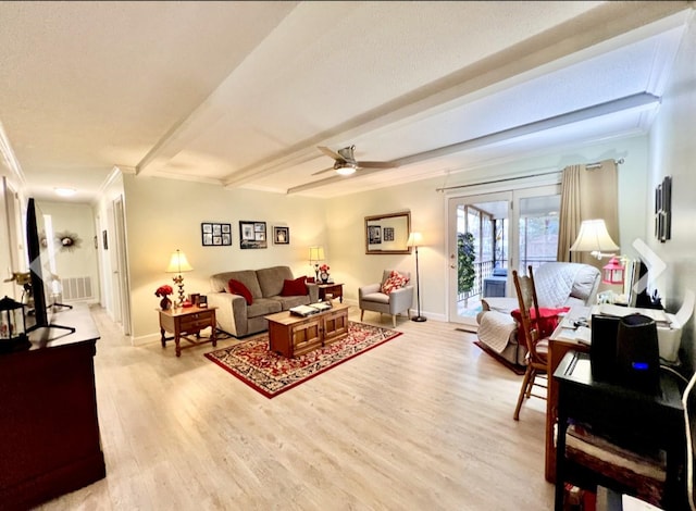 living room with ceiling fan, ornamental molding, beam ceiling, and light wood-type flooring