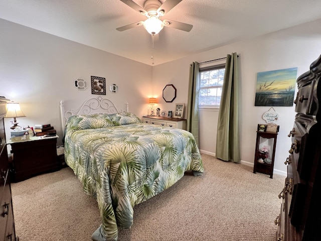 bedroom featuring ceiling fan and light carpet