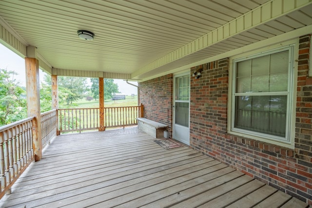 wooden terrace featuring a porch