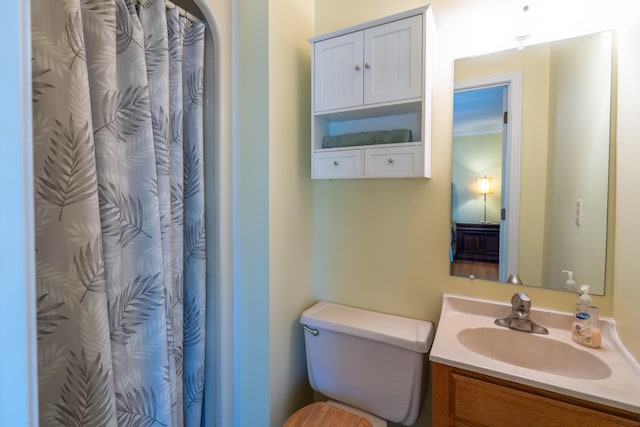 bathroom featuring vanity and toilet