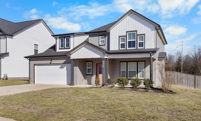 view of front of property with a garage, a porch, and a front lawn