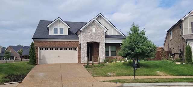 view of front of house featuring a garage and a front yard