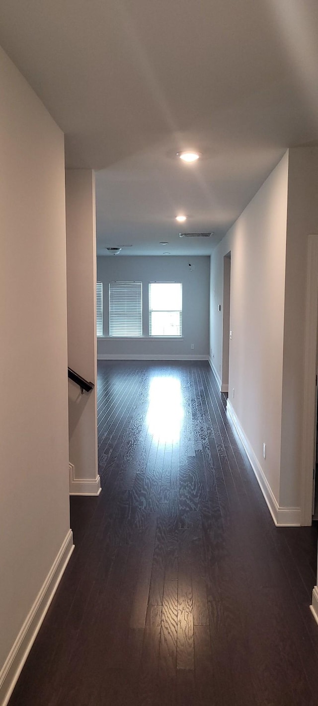 spare room with dark hardwood / wood-style floors