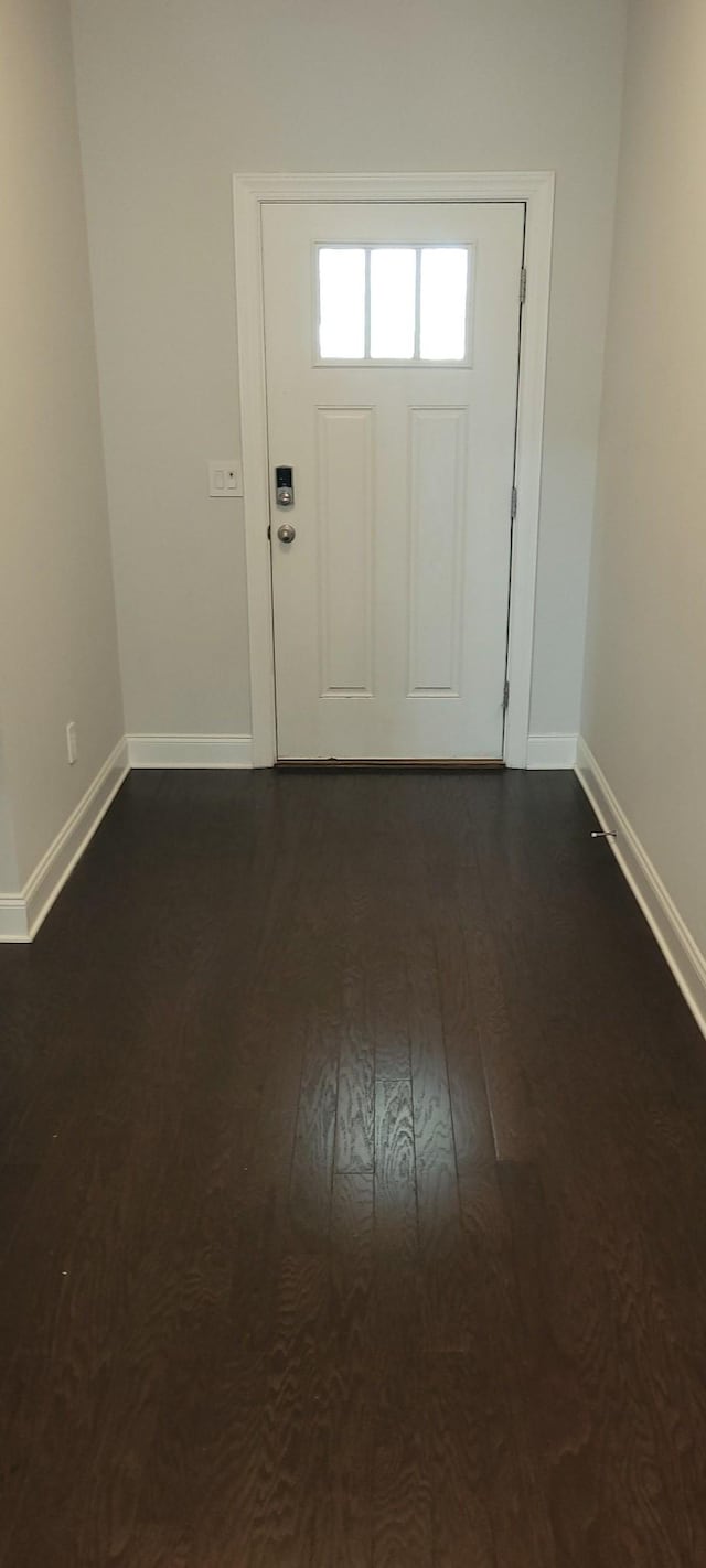 foyer with dark hardwood / wood-style floors