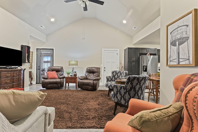 living room with high vaulted ceiling and ceiling fan