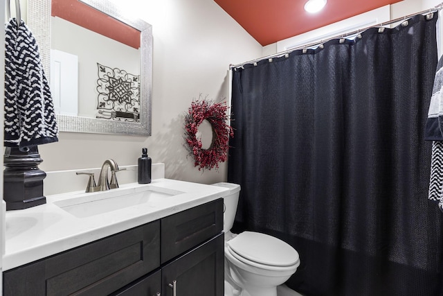 full bathroom with vanity, shower / bath combination with curtain, and toilet