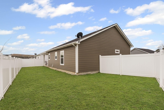 view of home's exterior with a yard