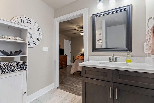 bathroom with ceiling fan, vanity, and tile patterned floors