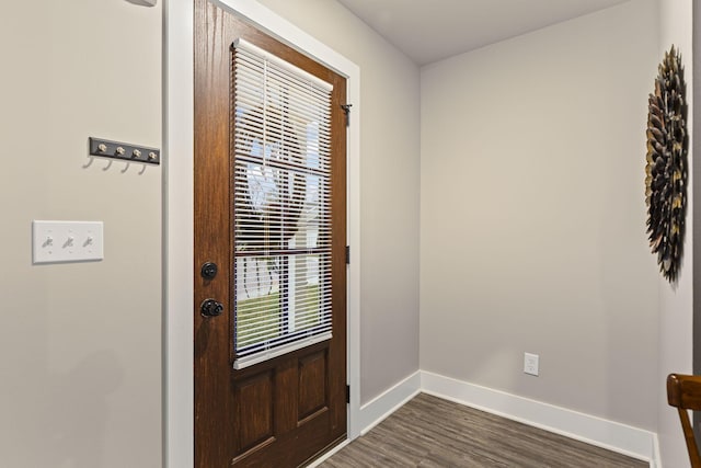 doorway to outside with dark wood-type flooring