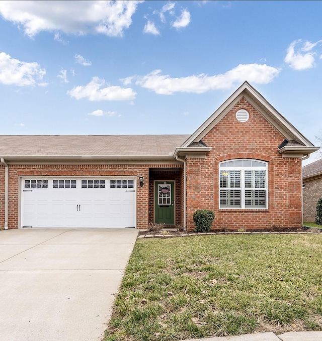 view of front of home with a garage and a front lawn