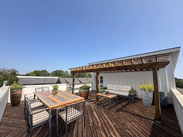 wooden terrace featuring a pergola and outdoor lounge area