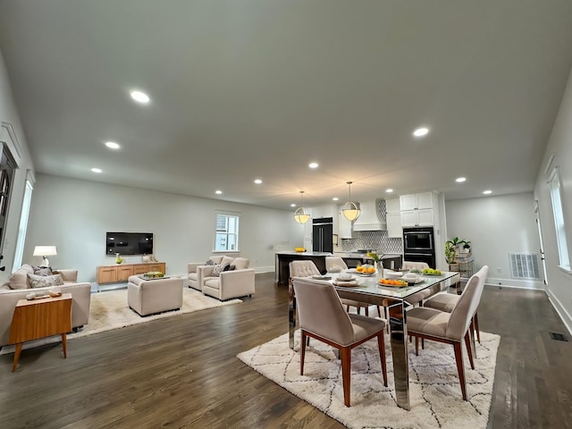 dining area with dark hardwood / wood-style floors