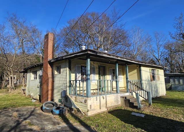 bungalow featuring a front yard and a porch