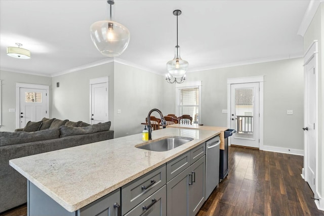 kitchen with sink, a kitchen island with sink, hanging light fixtures, dark hardwood / wood-style floors, and stainless steel dishwasher