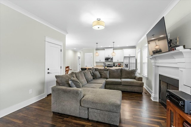 living room with dark wood-type flooring and ornamental molding