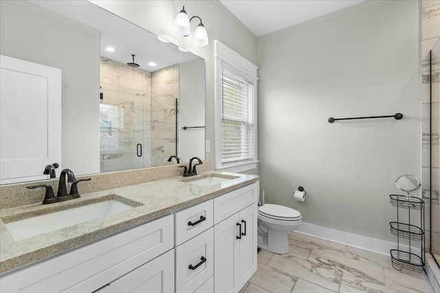 bathroom with vanity, toilet, and an enclosed shower